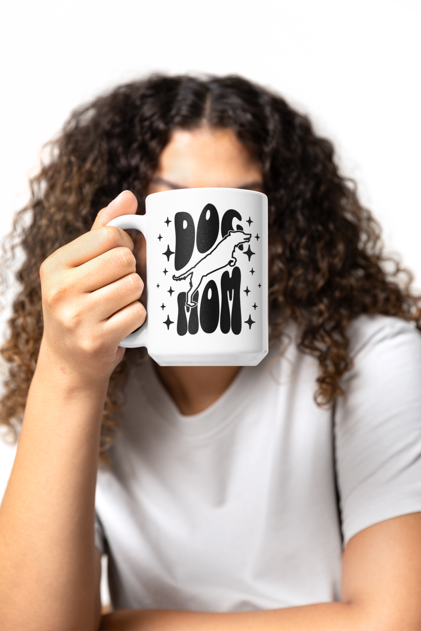Dog Mom mug 15oz held by curly-haired woman — glossy white ceramic mug with twinkling star design