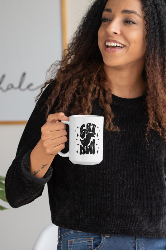 Cat Mom mug 15oz held by long-haired woman — glossy white ceramic mug with twinkling star design