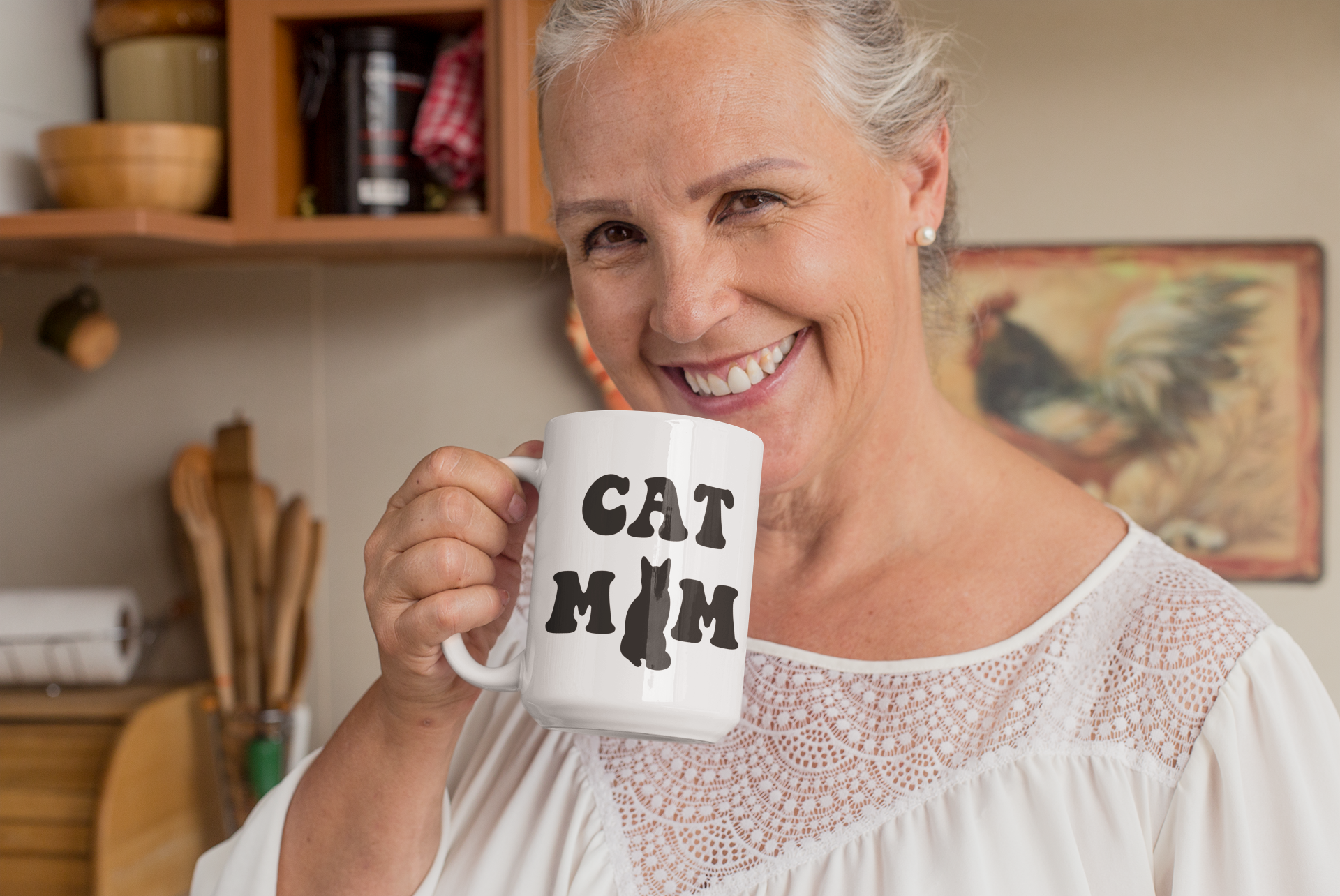 Cat Mom ceramic mug 15oz – bold black retro cat silhouette design, held by woman at home