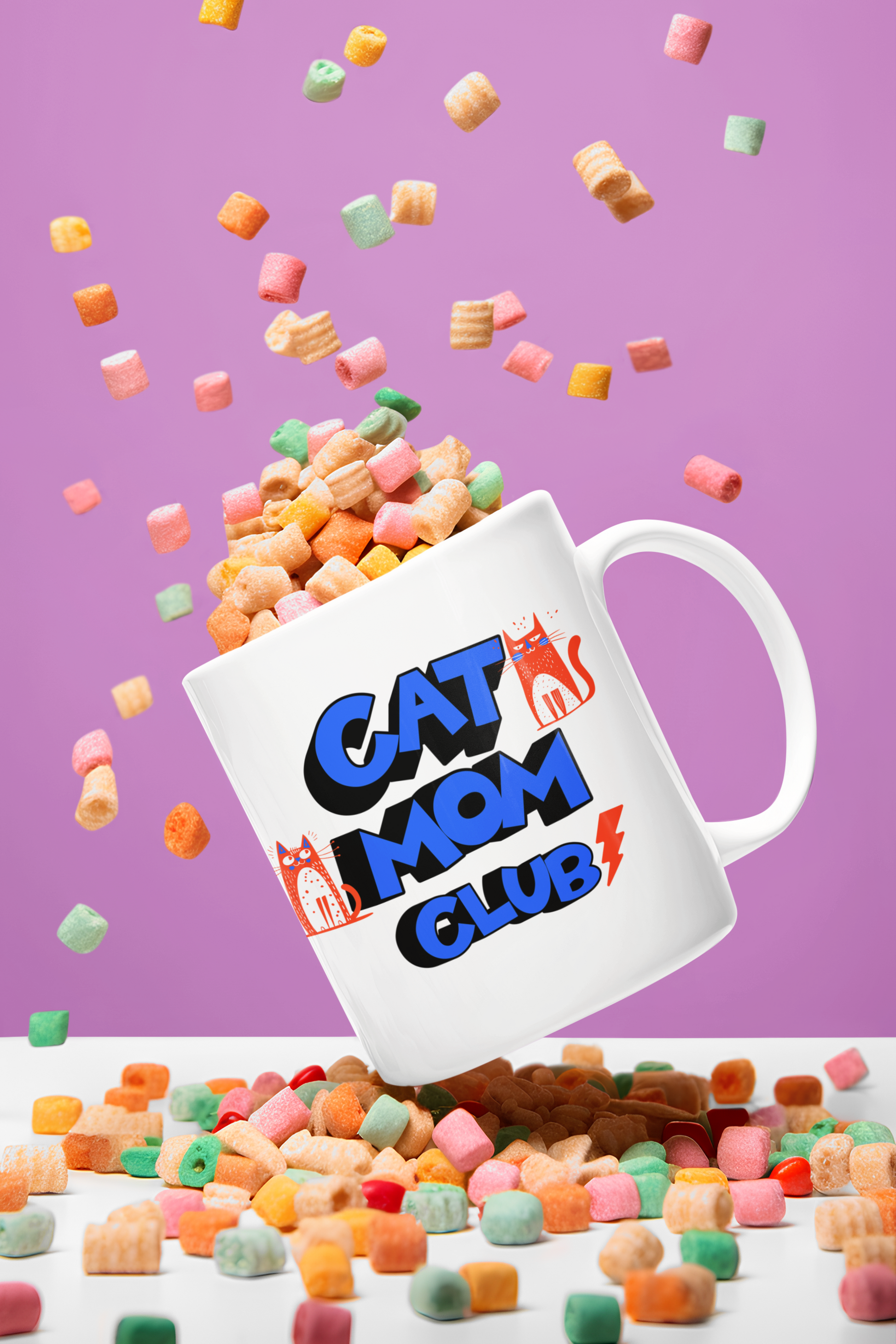 Cat Mom Club mug floating among cereal flakes — colorful retro ceramic mug with orange cat design
