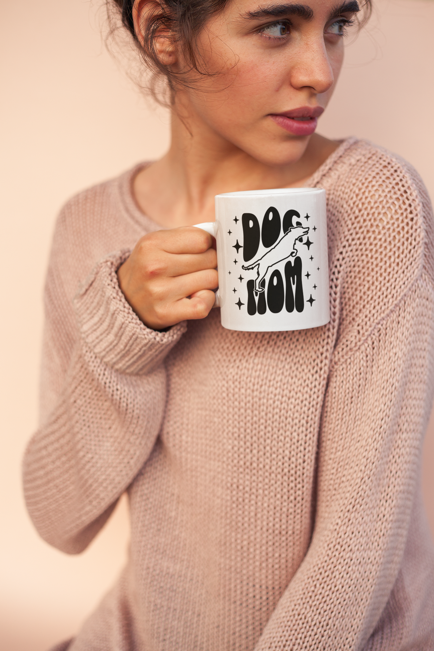 Woman in cozy sweater holding Dog Mom ceramic mug — perfect gift for dog moms