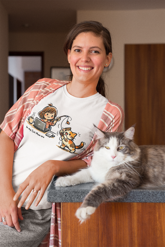 Woman wearing In My Cat Mom Era T-Shirt while playing with her cat – cat mom graphic tee | WhiskersMethod

