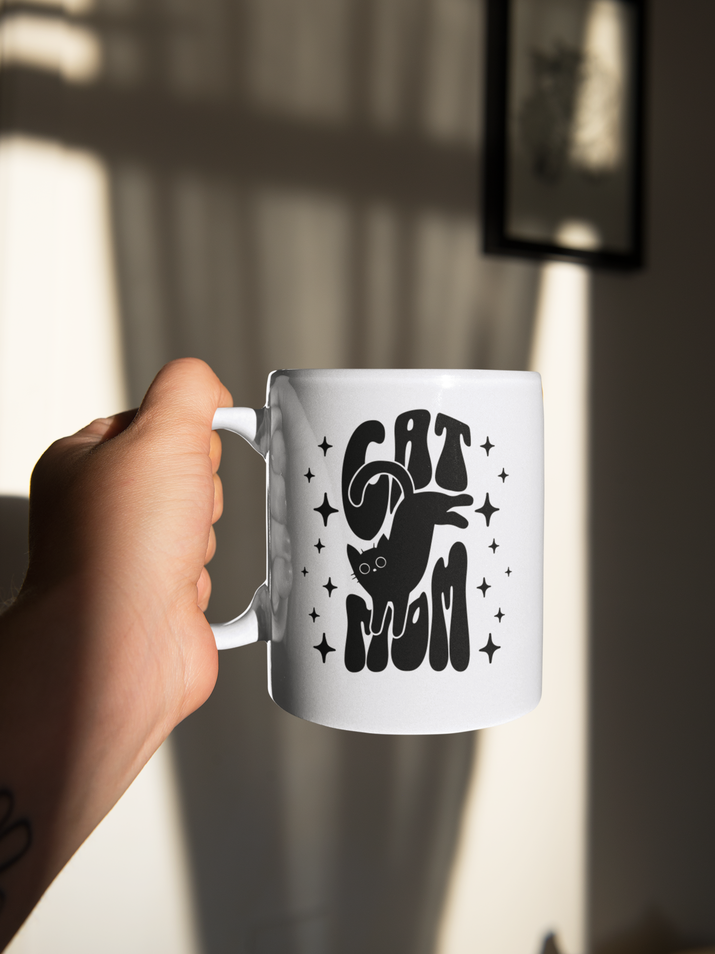  Cat Mom ceramic mug — elegant black lettering with star accents, perfect gift for cat moms
